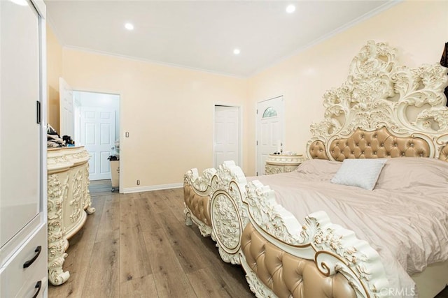 bedroom featuring a closet, crown molding, and hardwood / wood-style flooring