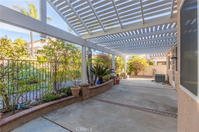 view of patio with central AC and a pergola