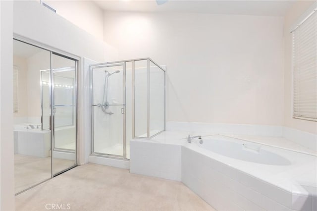 bathroom with separate shower and tub