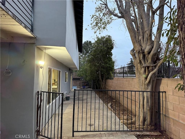 view of gate featuring fence