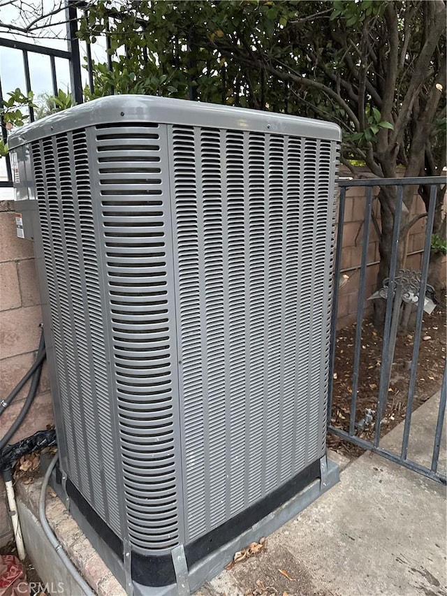 exterior details featuring fence and central air condition unit