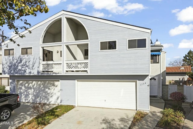 rear view of property with a garage