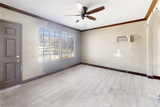 unfurnished room with ceiling fan, a wall mounted AC, crown molding, and wood-type flooring