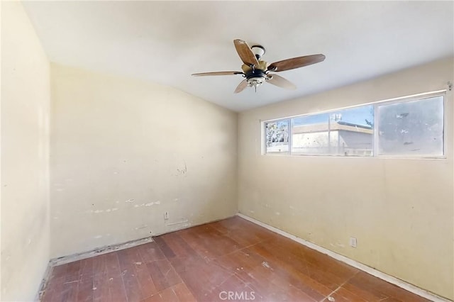 unfurnished room with ceiling fan and hardwood / wood-style flooring