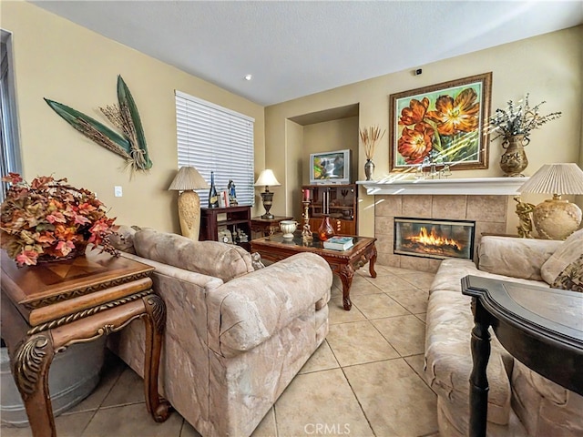 tiled living room featuring a tile fireplace