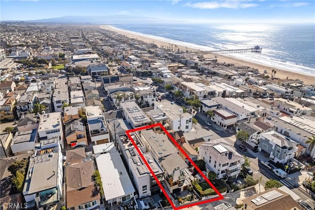 birds eye view of property featuring a view of the beach and a water view