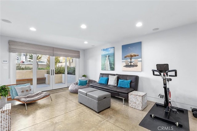 living area with finished concrete flooring, french doors, baseboards, and recessed lighting