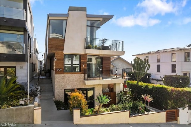 contemporary home featuring stucco siding