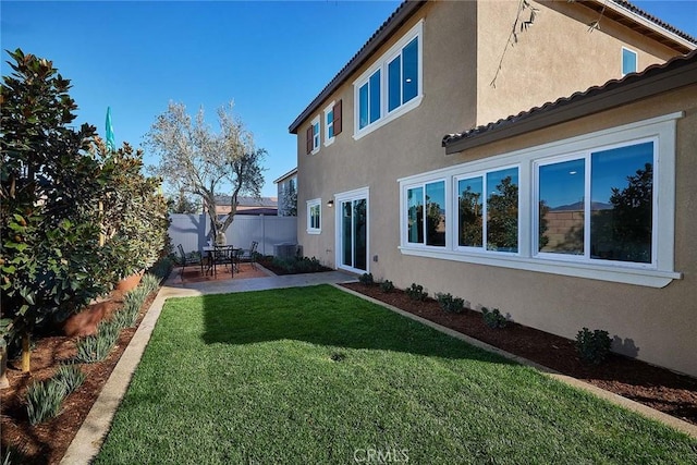 exterior space with central AC unit and a patio