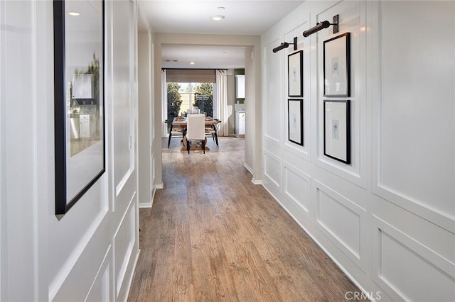 hallway with light wood-type flooring