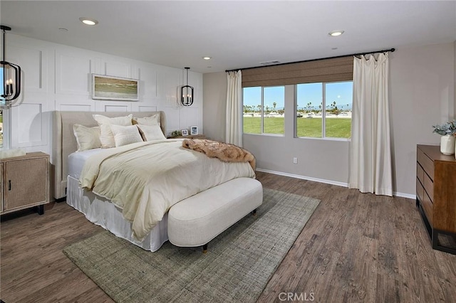 bedroom with dark wood-type flooring