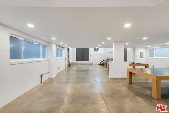 basement featuring electric panel and pool table