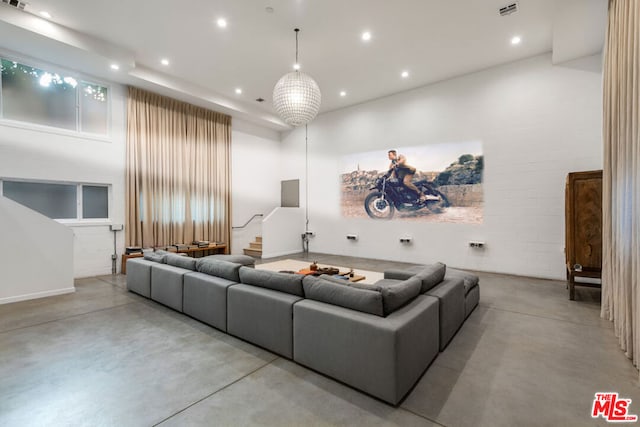 home theater room with a high ceiling