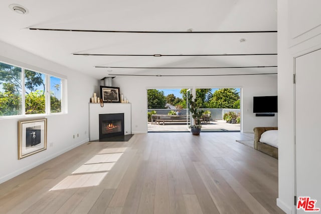 unfurnished living room with light hardwood / wood-style floors