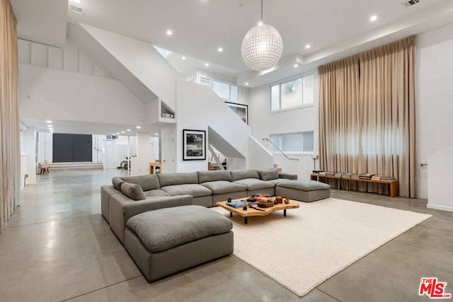 living room featuring a high ceiling