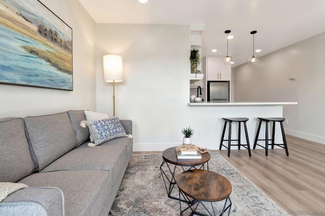 living room with light hardwood / wood-style flooring