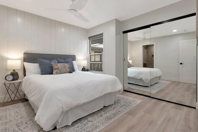 bedroom with light wood-type flooring and ceiling fan