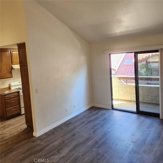 spare room with dark hardwood / wood-style flooring