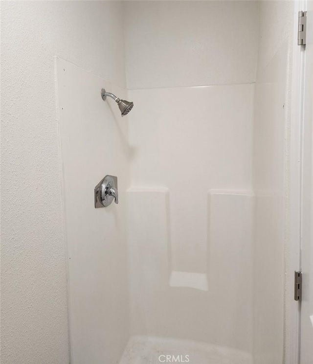 interior details with a shower