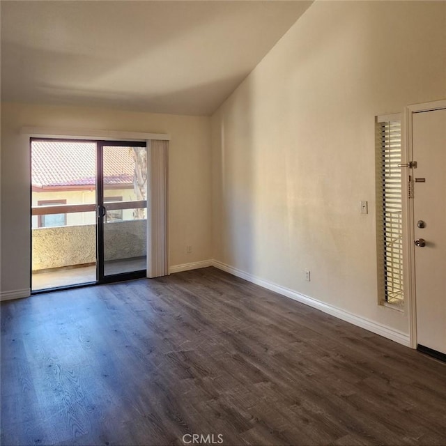 unfurnished room with dark wood-type flooring