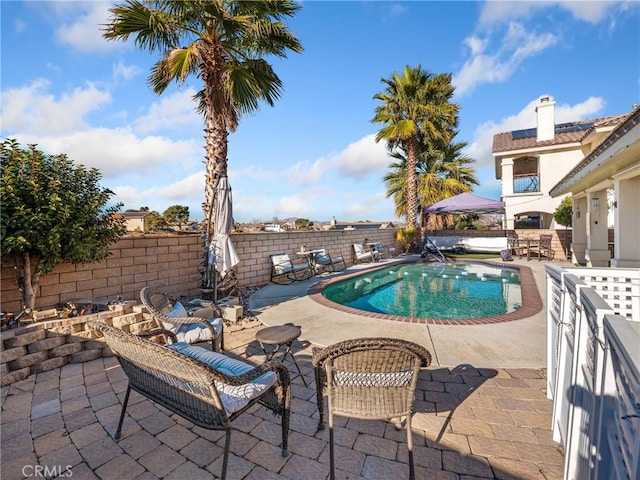 view of swimming pool featuring a patio