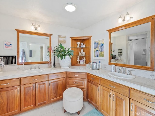 bathroom featuring tile patterned floors, vanity, an inviting chandelier, and walk in shower