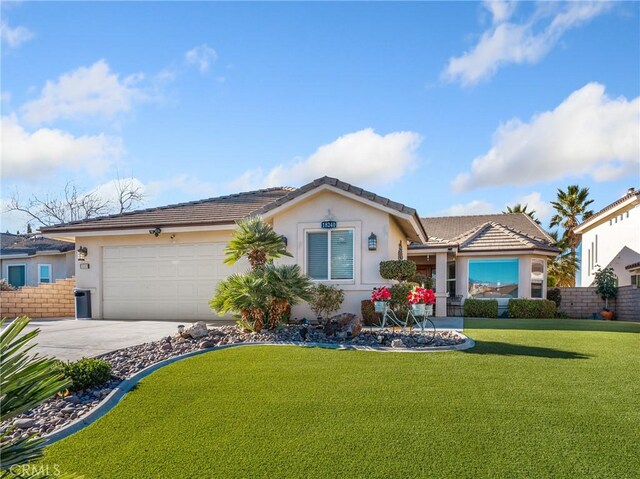 single story home with a front lawn and a garage