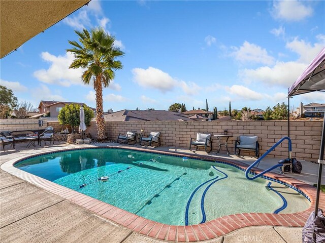 view of swimming pool featuring a patio