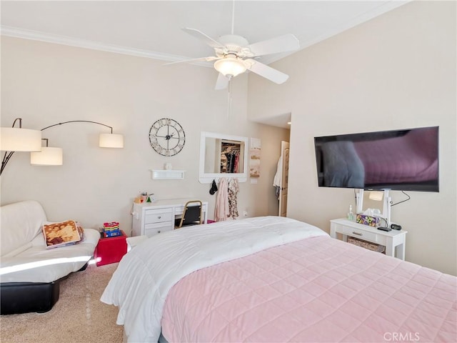 carpeted bedroom with ceiling fan and crown molding