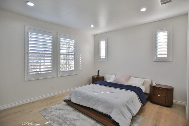 bedroom featuring light wood-type flooring