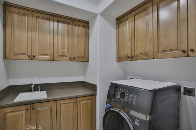 laundry room with washer / clothes dryer, sink, and cabinets