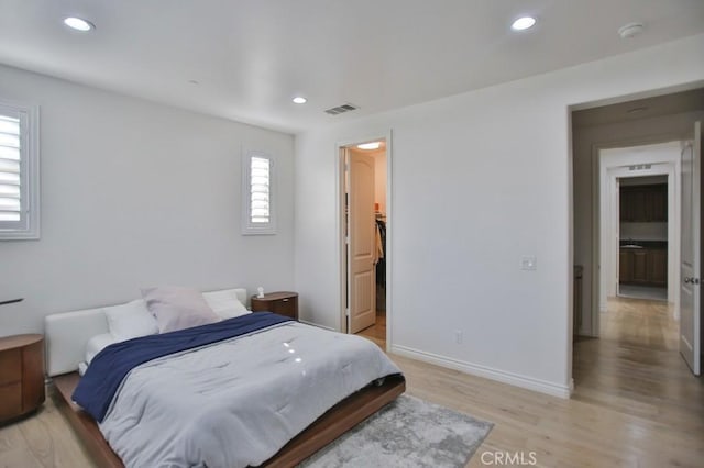 bedroom with light wood-type flooring