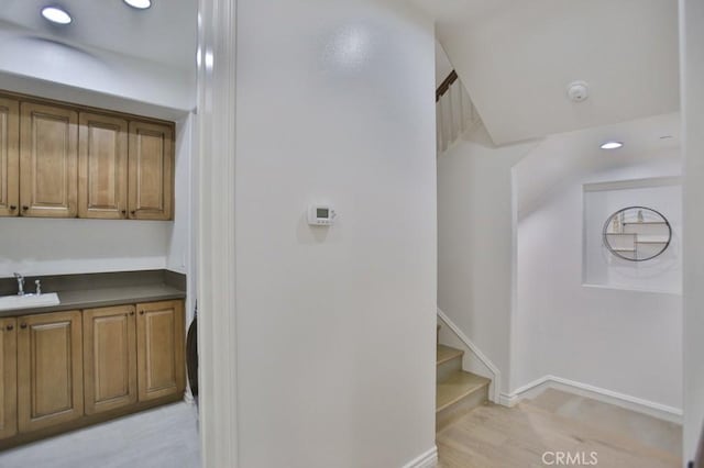 interior space with sink and light wood-type flooring