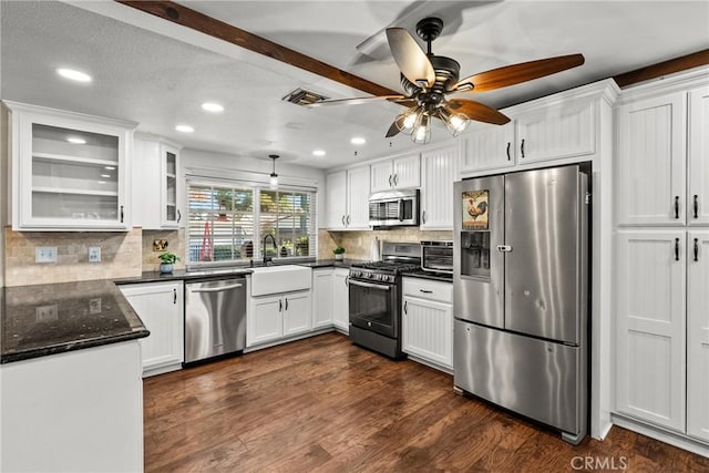 kitchen with ceiling fan, stainless steel appliances, white cabinetry, and sink