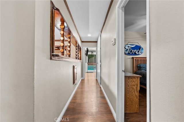 hall with crown molding and hardwood / wood-style floors