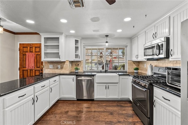 kitchen featuring stainless steel appliances, white cabinets, and sink