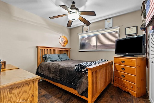 bedroom with dark wood-type flooring and ceiling fan