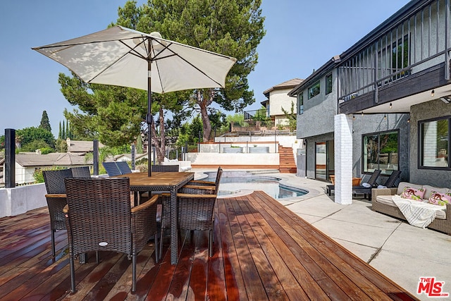 wooden deck featuring outdoor lounge area