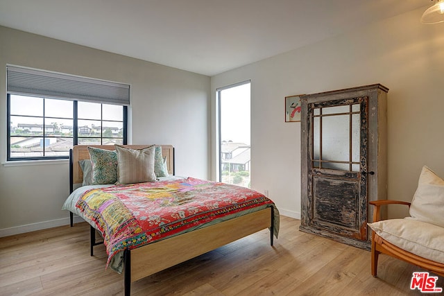 bedroom with light hardwood / wood-style flooring