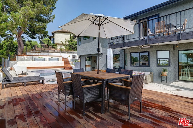 wooden terrace featuring a patio