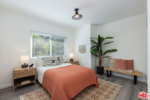 bedroom with light hardwood / wood-style flooring