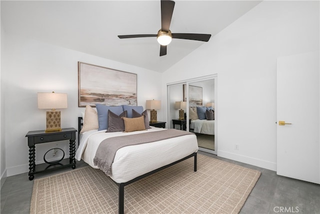 bedroom featuring ceiling fan, a closet, and vaulted ceiling