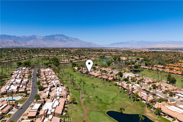 drone / aerial view with a water and mountain view