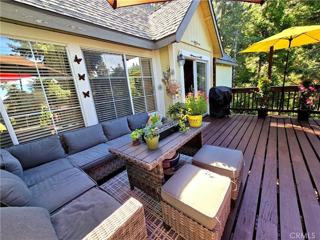 deck with area for grilling and an outdoor hangout area