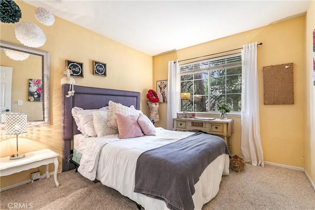 bedroom featuring light carpet