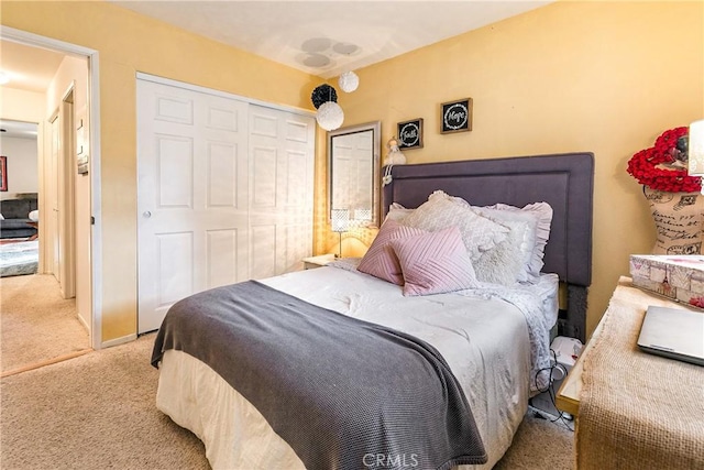 bedroom with a closet and carpet floors