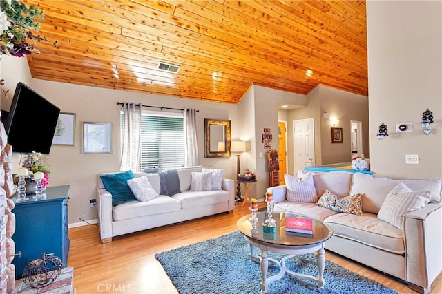 living room with lofted ceiling, light hardwood / wood-style floors, and wooden ceiling