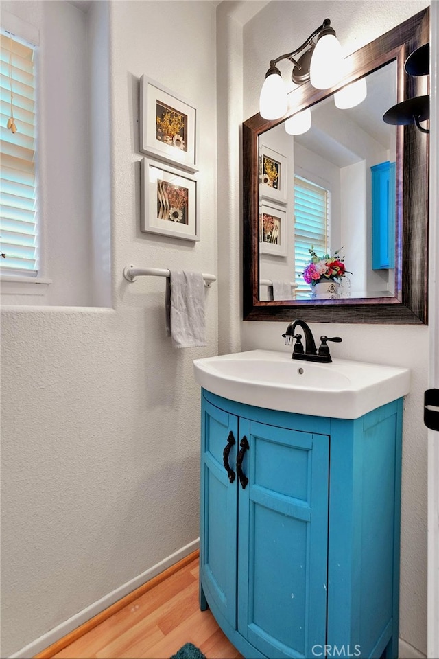 bathroom with vanity and hardwood / wood-style flooring