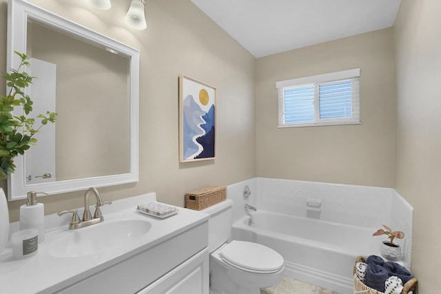 bathroom with toilet, vanity, tile patterned flooring, and a bathing tub