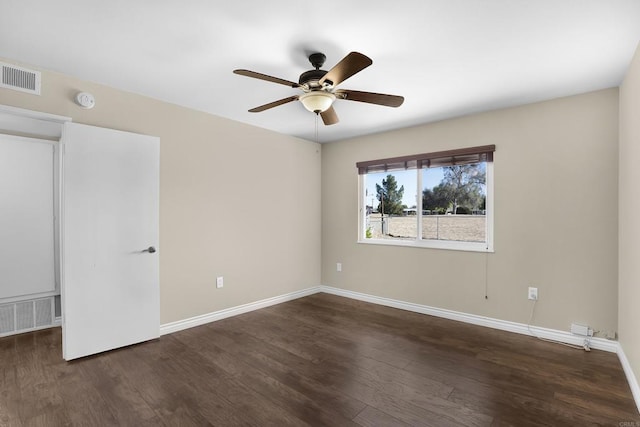 unfurnished bedroom with ceiling fan and dark hardwood / wood-style floors